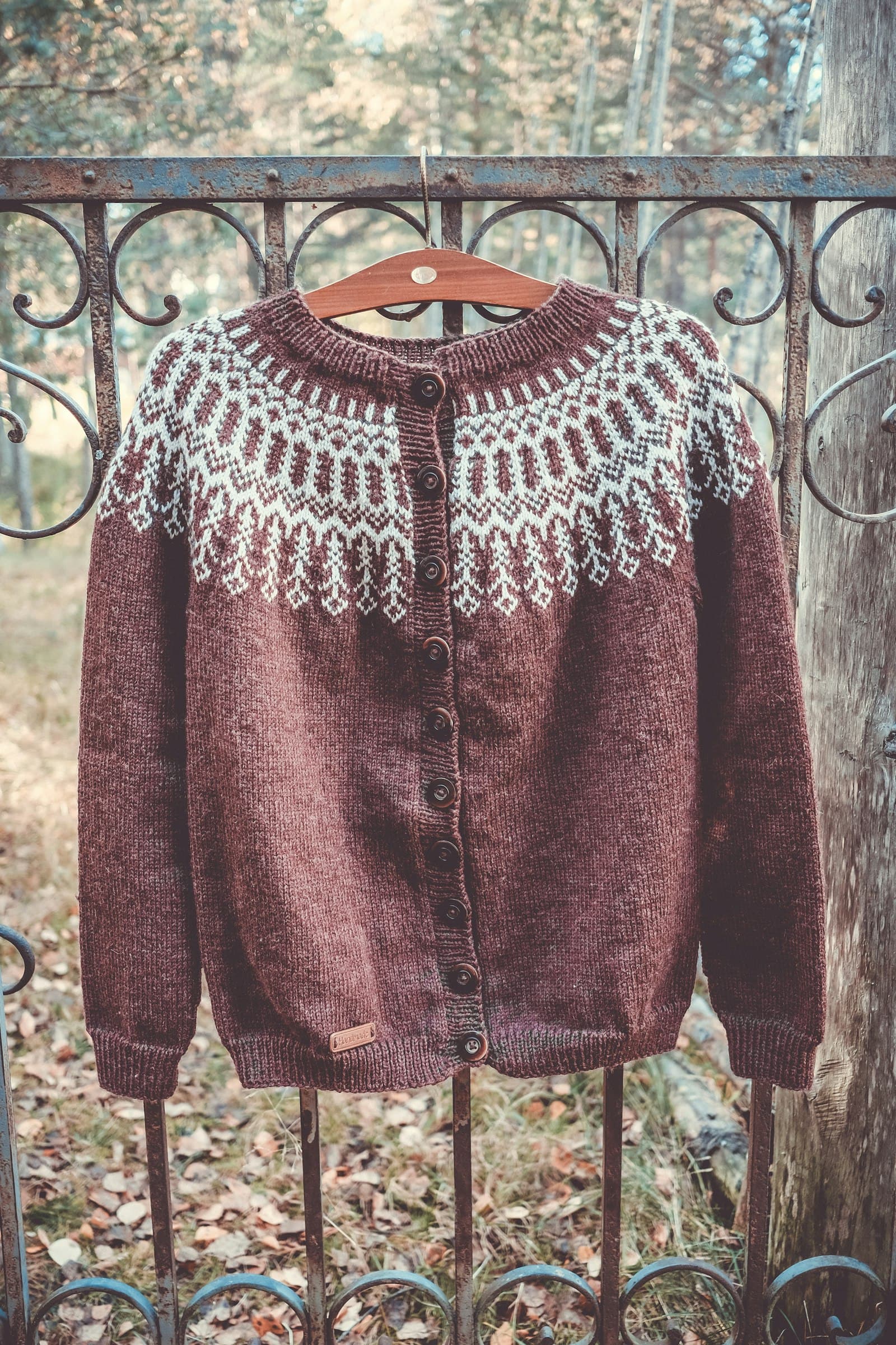 Brown knitted cardigan with white nordic pattern