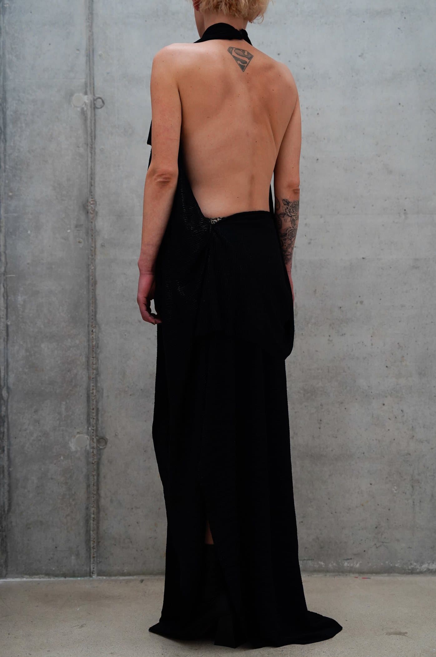 Black halter gown with a deep open back