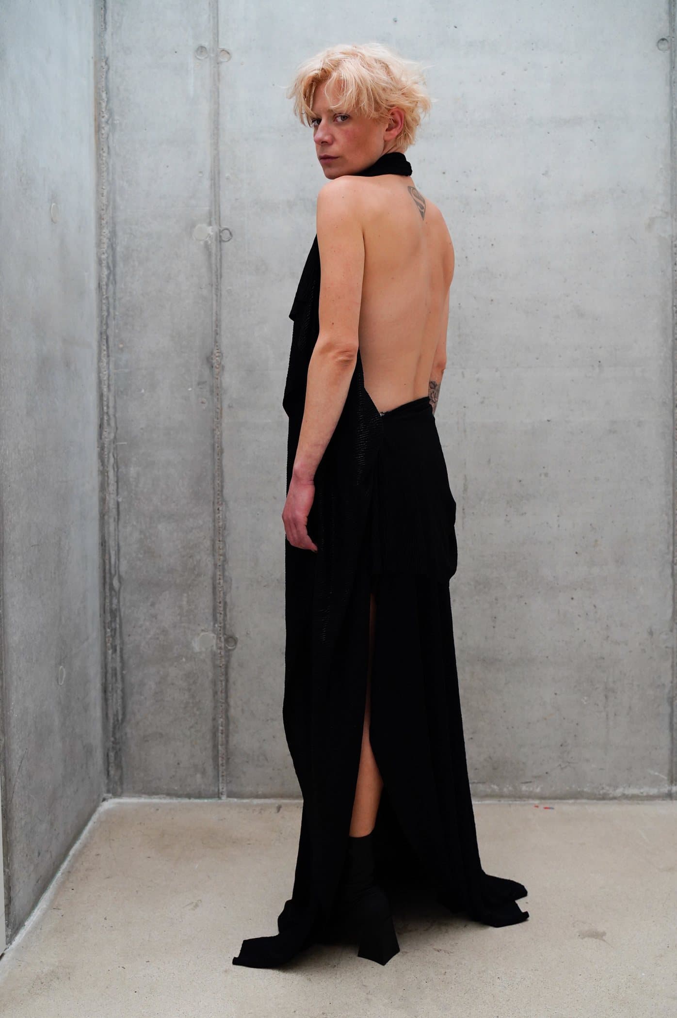 Black halter gown with a deep open back