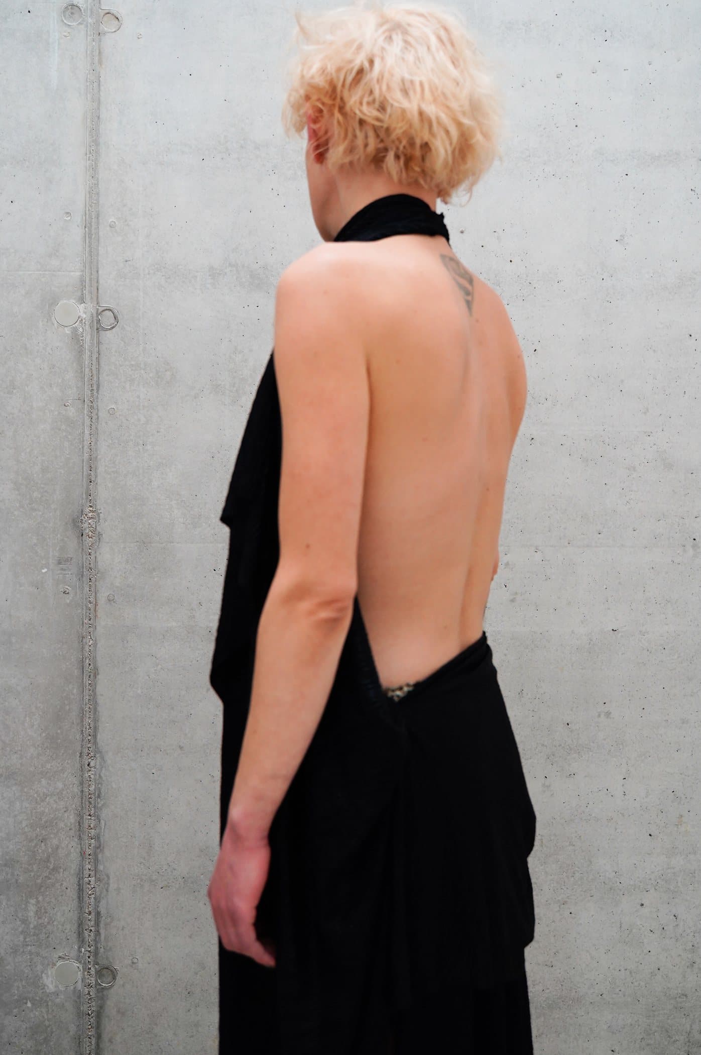 Black halter gown with a deep open back